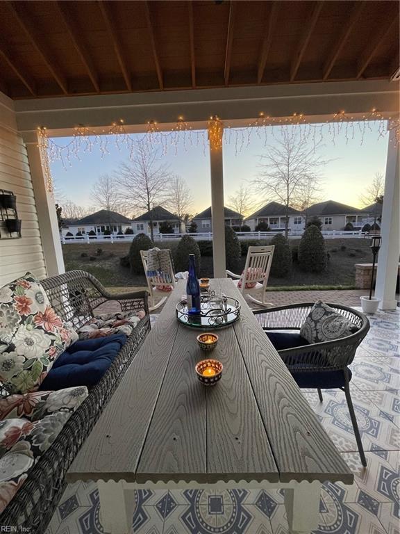 patio terrace at dusk with outdoor dining space