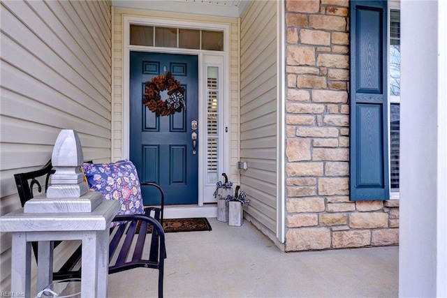 doorway to property featuring stone siding