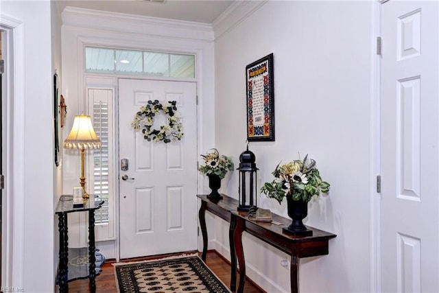 entryway with dark wood finished floors and crown molding