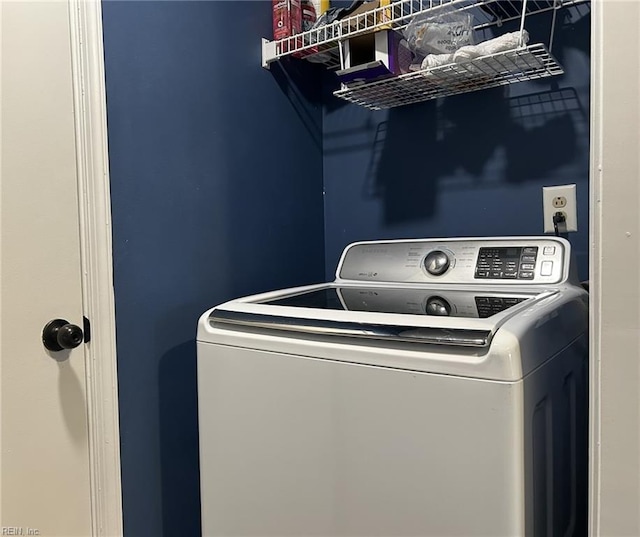 washroom featuring washer / clothes dryer and laundry area