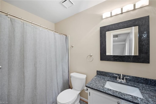 bathroom with toilet, visible vents, and vanity