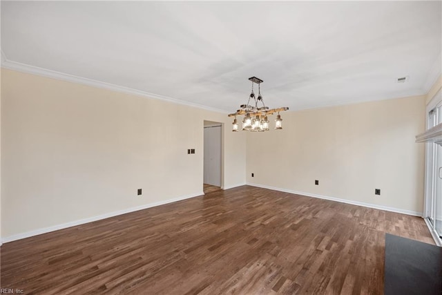 unfurnished dining area with crown molding, baseboards, and wood finished floors