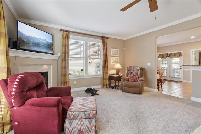 living room featuring crown molding, a fireplace, carpet flooring, and tile patterned floors