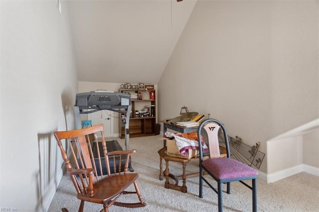 living area featuring baseboards, vaulted ceiling, and carpet flooring