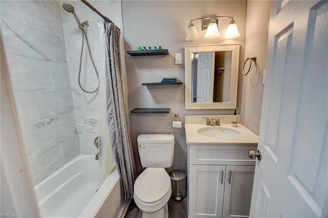 full bathroom with shower / tub combo with curtain, vanity, and toilet