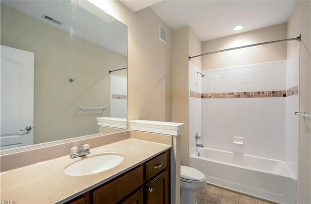 full bath featuring washtub / shower combination, visible vents, vanity, and toilet