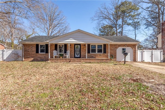 ranch-style home with covered porch, a gate, and brick siding