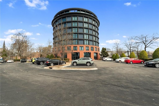 view of property featuring uncovered parking