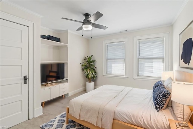 bedroom with a ceiling fan, carpet flooring, visible vents, and crown molding