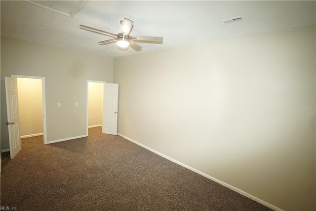 unfurnished bedroom featuring a ceiling fan, baseboards, visible vents, and carpet flooring