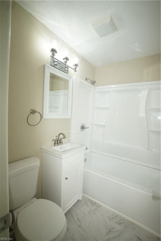 bathroom featuring marble finish floor, visible vents, toilet, washtub / shower combination, and vanity