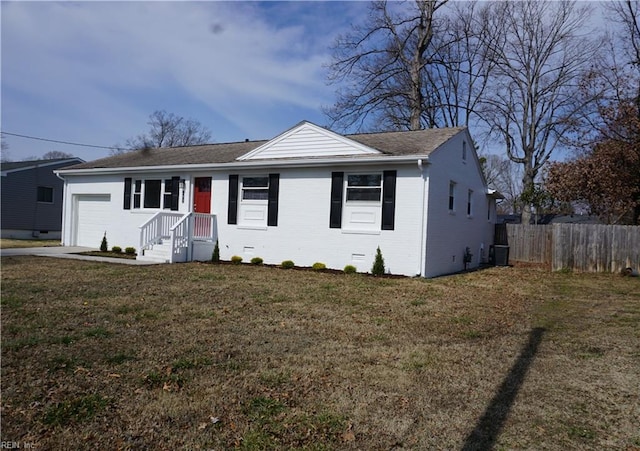 view of front of house featuring central air condition unit, a garage, brick siding, fence, and crawl space