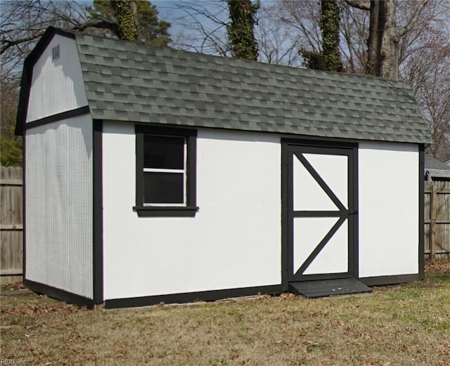 view of shed with fence