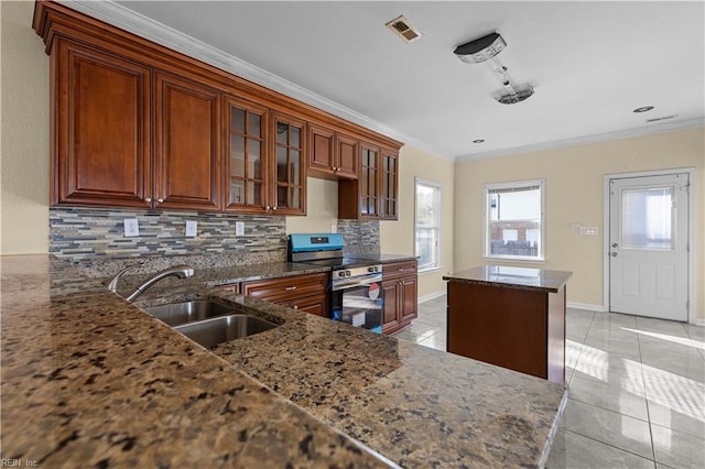 kitchen with light tile patterned floors, a sink, visible vents, stainless steel range with electric stovetop, and crown molding