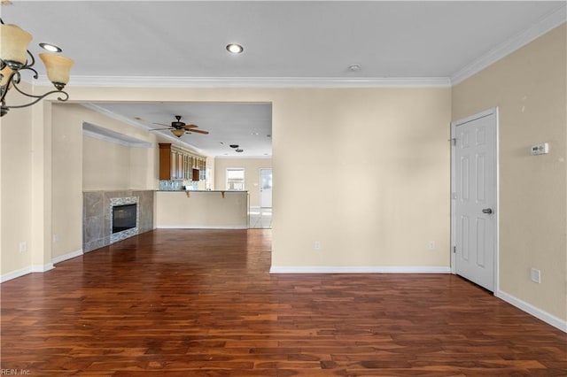 unfurnished living room featuring baseboards, a tile fireplace, wood finished floors, crown molding, and ceiling fan with notable chandelier