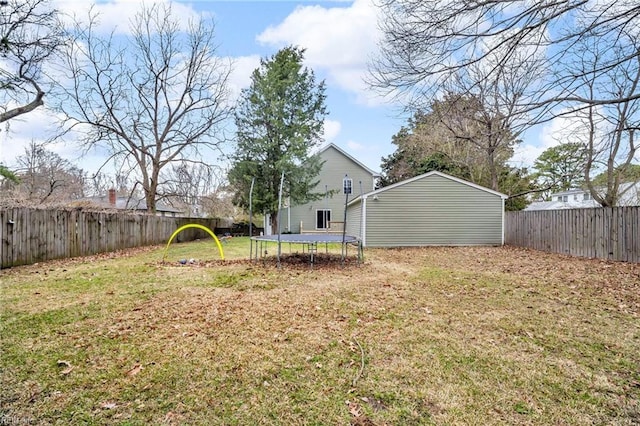 view of yard featuring a fenced backyard and a trampoline