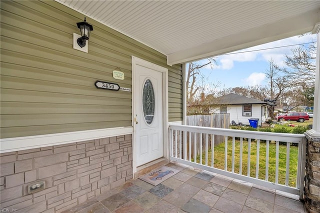 property entrance with covered porch