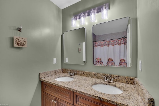 bathroom featuring double vanity and a sink