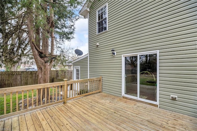 wooden deck featuring fence