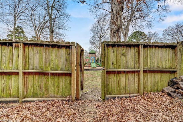 view of gate featuring fence