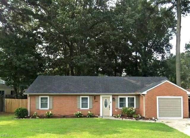 ranch-style house with a front lawn, fence, and brick siding