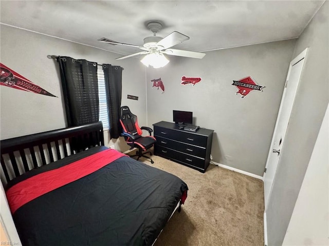 bedroom with carpet floors, a ceiling fan, and baseboards