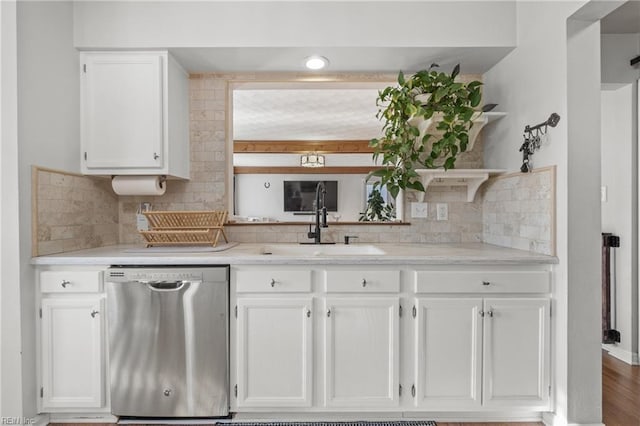 kitchen with a sink, white cabinets, decorative backsplash, dishwasher, and open shelves