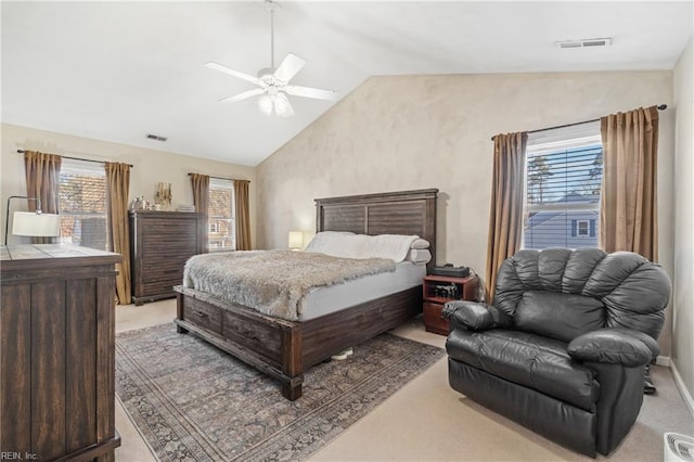 bedroom with vaulted ceiling, multiple windows, and visible vents