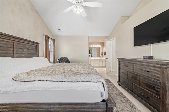 bedroom with lofted ceiling, ceiling fan, visible vents, and ensuite bathroom