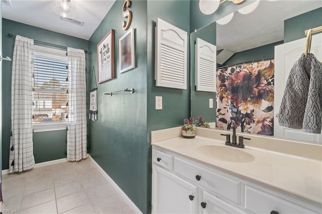 full bathroom with visible vents, vanity, baseboards, and tile patterned floors