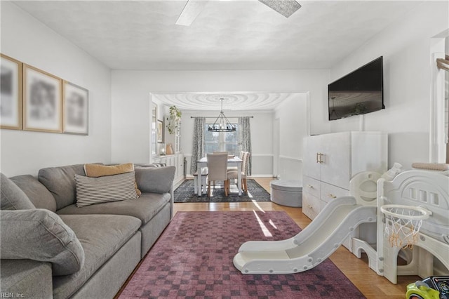 living room featuring a chandelier and wood finished floors