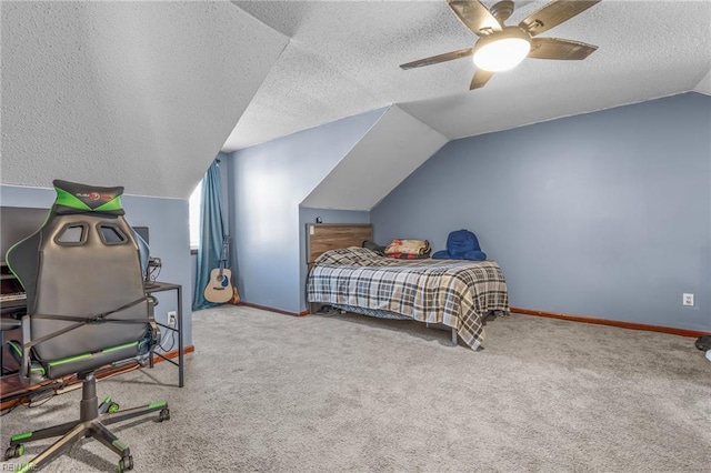 bedroom with lofted ceiling, carpet floors, a textured ceiling, and baseboards