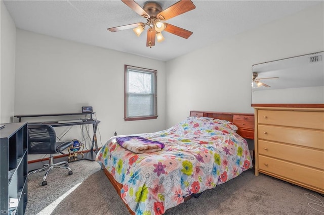 bedroom featuring ceiling fan, carpet flooring, and visible vents