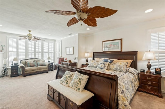 bedroom with ornamental molding, recessed lighting, and light colored carpet