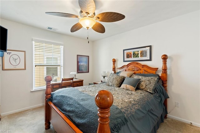 carpeted bedroom with visible vents, ceiling fan, and baseboards