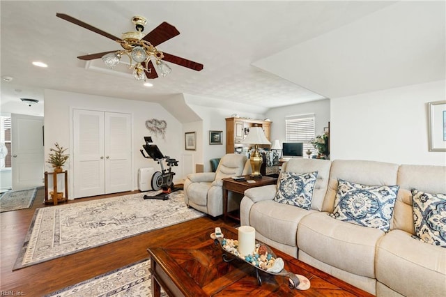 living area with a ceiling fan, wood finished floors, and recessed lighting