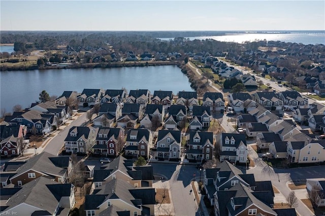 bird's eye view with a residential view and a water view