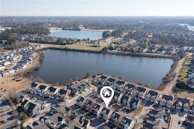 birds eye view of property featuring a residential view and a water view