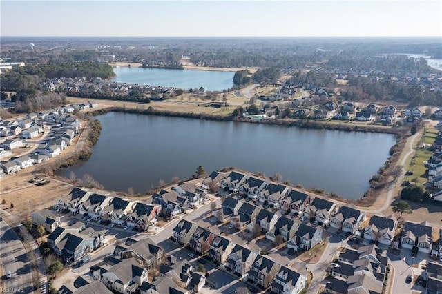 birds eye view of property with a water view and a residential view