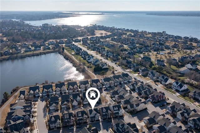 aerial view with a residential view and a water view