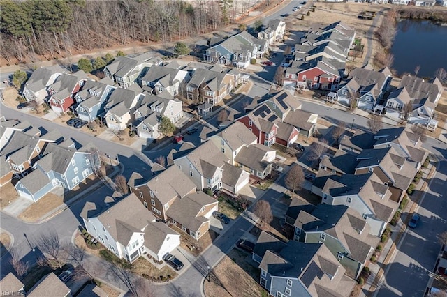 drone / aerial view with a residential view and a water view