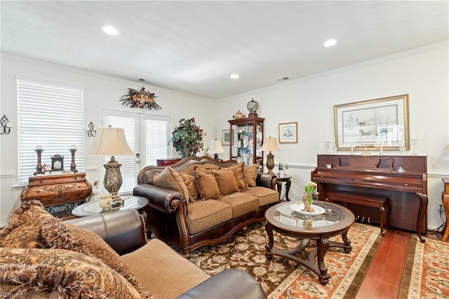 living room with ornamental molding, wood finished floors, and recessed lighting