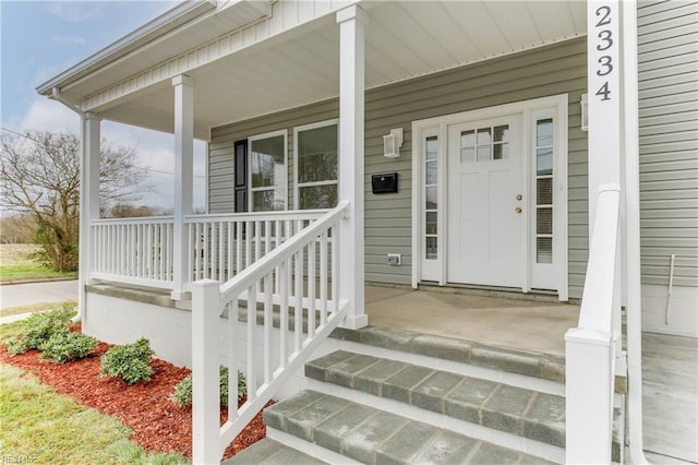 doorway to property featuring a porch