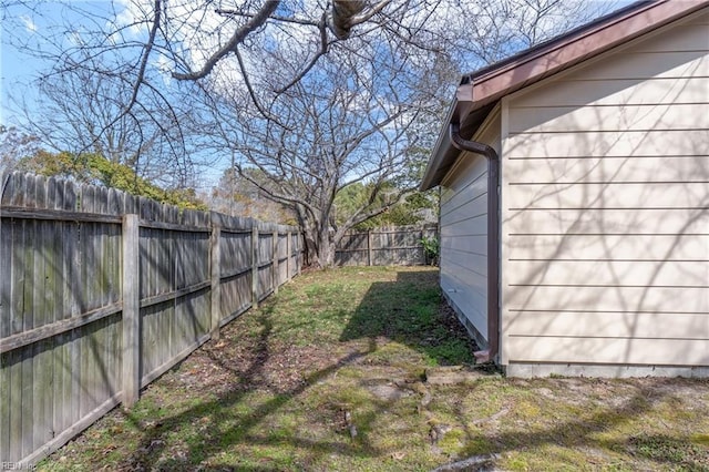 view of yard with a fenced backyard