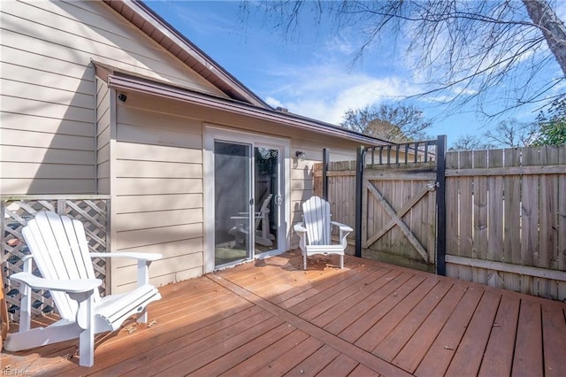 wooden deck with fence and a gate