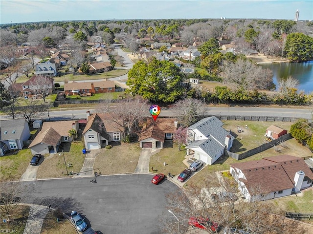 birds eye view of property with a water view and a residential view