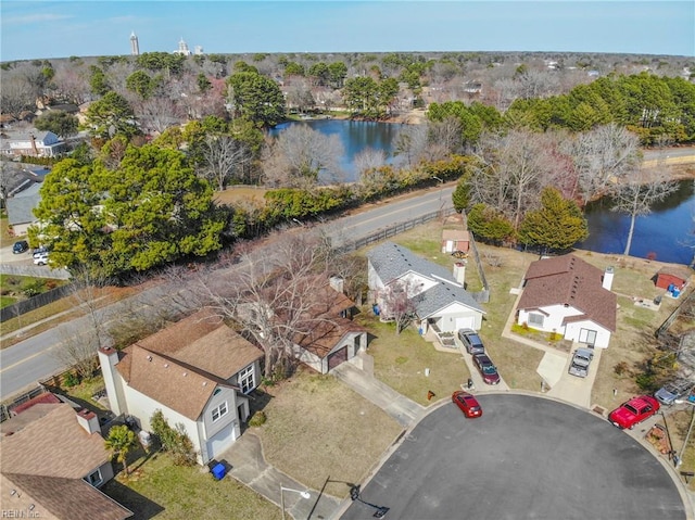 drone / aerial view with a water view and a residential view