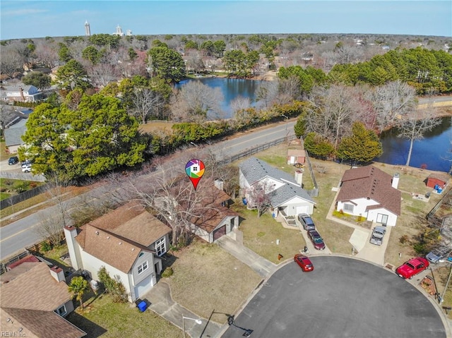 drone / aerial view featuring a residential view and a water view