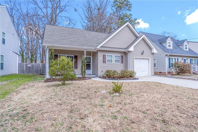 view of front of home with roof with shingles, a front yard, fence, a garage, and driveway