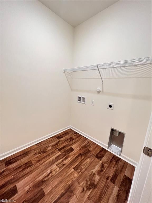 laundry area with laundry area, baseboards, dark wood-type flooring, washer hookup, and electric dryer hookup